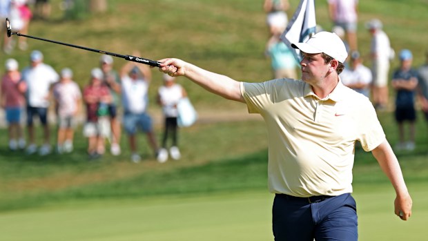 Robert MacIntyre reacts to his putt on the 14th green during the third round of the 2025 BMW Championship.