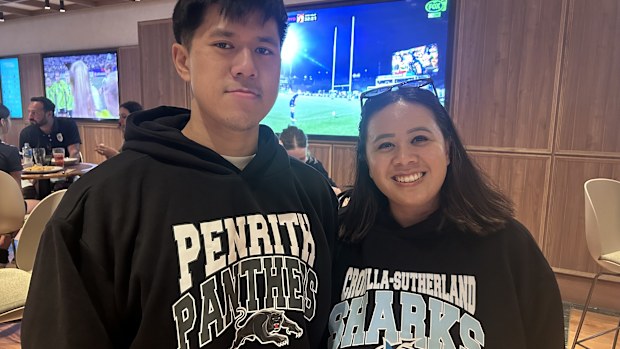 Steven and Sindy watching the Panthers vs Sharks game together in Kmart merch