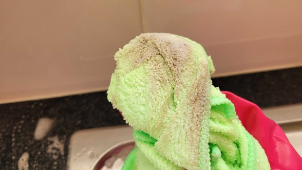 Cloth covered in dirt after wiping around a scrubbed sink, microfibre cloth, cleaning