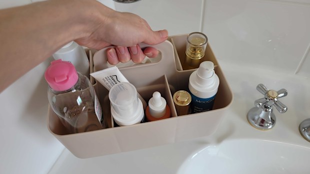 Kmart art and craft caddy used as a skincare organiser on bathroom vanity, which can be removed and put in the cabinet below