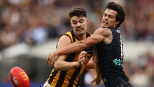 Hawk Conor Nash and Blue Jack Silvagni compete for the ball.