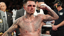 George Kambosos celebrates his split decision win against Teofimo Lopez in 2021.