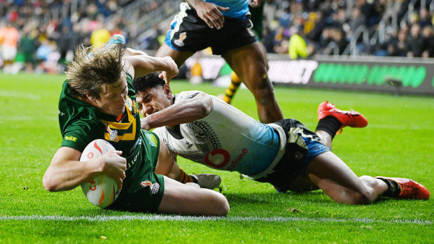 Harry Grant of Australia touches down for their side's fifth try during the Rugby League World Cup 2021 Pool B match between Australia and Fiji at Headingley on October 15, 2022 in Leeds, England. (Photo by Gareth Copley/Getty Images)