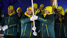 Team Australia flag bearers Jakara Anthony and Matt Graham lead the charge during the Milano Cortina 2026 Opening Ceremony at Livigno Snow Park.