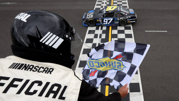 Shane Van Gisbergen, driver of the #97 Quad Lock Chevrolet, takes the checkered flag to win the NASCAR Xfinity Series Pacific Office Automation 147 at Portland International Raceway on June 01, 2024 in Portland, Oregon. (Photo by Meg Oliphant/Getty Images)