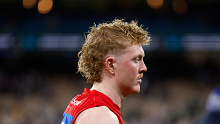 Clayton Oliver of the Demons looks dejected after his side's loss to Collingwood.