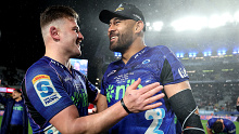 Dalton Papalii and Patrick Tuipulotu of the Blues celebrate after winning.