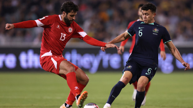 Khalil Khamis of Lebanon and Patrick Yazbek of Australia compete for the ball during their FIFA World Cup 2026 qualifier match.