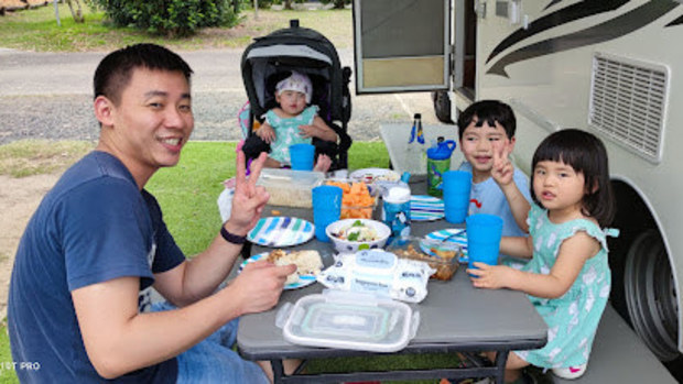 Elena with her family on holiday after being discharged from hospital.