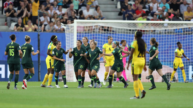 Sam Kerr of Australia celebrates with teammates after scoring her team's first goal. (Photo by Elsa/Getty Images)