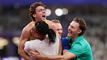 Armand Duplantis celebrates his latest world record with Emmanouil Karalis and Kurtis Marschall.