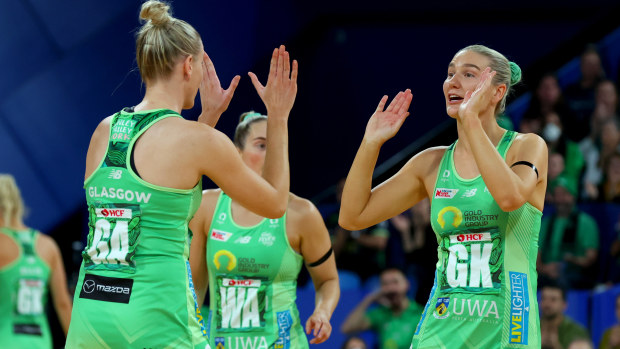 Courtney Bruce of the fever high fives Sasha Glasgow of the fever as she runs onto the court during the Super Netball Grand Final match between West Coast Fever and Melbourne Vixens at RAC Arena, on July 03, 2022, in Perth, Australia. (Photo by James Worsfold/Getty Images)