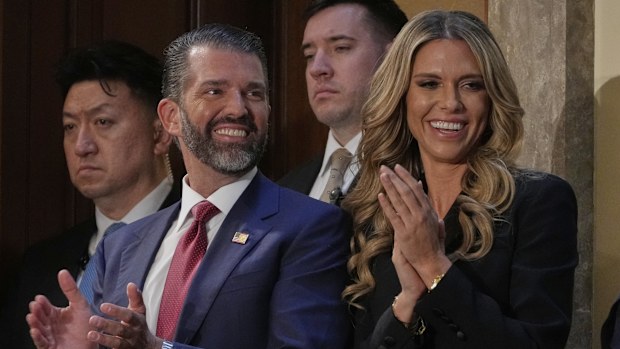 Donald Trump Jr., and Bettina Anderson, along with Tiffany Trump and her husband Michael Boulos, applaud as President Donald Trump addresses a joint session of Congress in the House chamber at the U.S. Capitol in Washington, Tuesday, March 4, 2025.