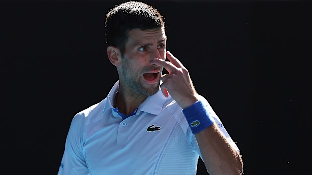 Novak Djokovic reacts in their semi-final singles match against Jannik Sinner at the 2024 Australian Open.