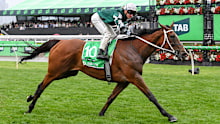Jockey James McDonald celebrates victory aboard Via Sistina.