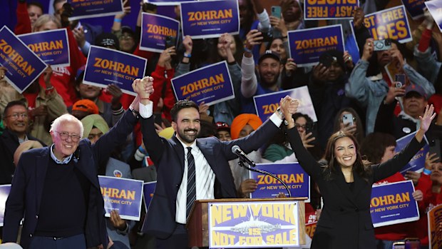 Senator Bernie Sanders, New York City mayoral candidate Zohran Mamdani, and Representative Alexandria Ocasio-Cortez appear on stage during a rally in New York.  