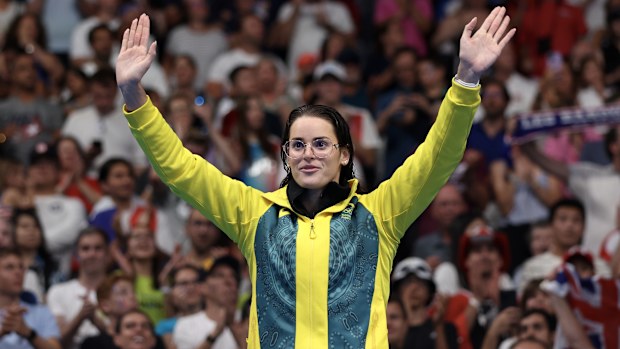 Gold medallist Kaylee McKeown celebrates on the podium after winning the women's 200m backstroke final at Paris 2024.