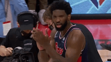 Joel Embiid give the refs a clap after the buzzer.
