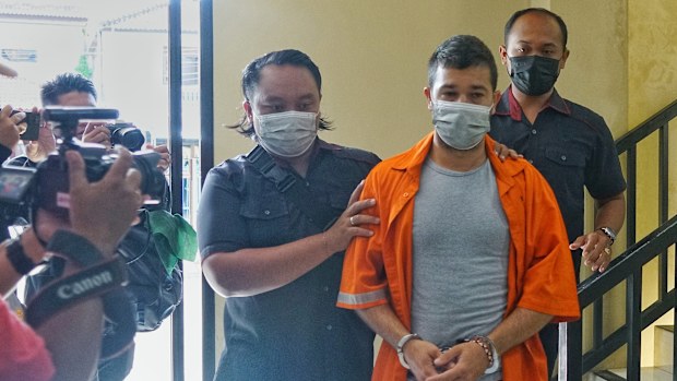 Australian-Italian dual citizen Antonio Strangio, 32, is pictured being transferred by police in Bali after being apprehended on an Interpol red notice from Italy.