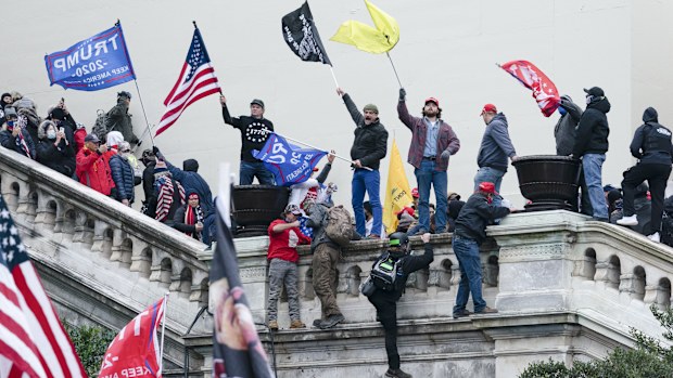 FILE - Rioters wave flags on the West Front of the U.S. Capitol in Washington on Jan. 6, 2021. (AP Photo/Jose Luis Magana, File)