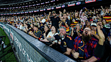 ADELAIDE, AUSTRALIA - APRIL 10: Crows fans celebrate a goal during the round five AFL match between Adelaide Crows and Geelong Cats at Adelaide Oval, on April 10, 2025, in Adelaide, Australia. (Photo by Mark Brake/Getty Images)