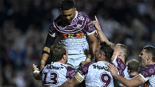 Manly players celebrate Jake Trbojevic's second half try against the Storm.