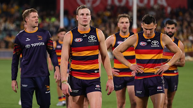 Crows captain Jordan Dawson  leads his team off the field after their semi-final defeat by the Hawks.