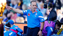 LAUNCESTON, AUSTRALIA - APRIL 01: Alastair Clarkson, Senior Coach of the Kangaroos coaches from the bench during the 2023 AFL Round 03 match between the Hawthorn Hawks and the North Melbourne Kangaroos at UTAS Stadium on April 1, 2023 in Launceston, Australia. (Photo by Dylan Burns/AFL Photos)