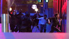 NSW Tactical Operations Unit police officers keep watch outside the Lindt Chocolat Cafe in Martin Place in Sydney on Tuesday 16 December 2014. Photo: Andrew Meares