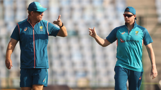 DELHI, INDIA - FEBRUARY 15: Australian coach Andrew McDonald and Steve Smith check the pitch during an Australia Test squad training session at Arun Jaitley Stadium on February 15, 2023 in Delhi, India. (Photo by Robert Cianflone/Getty Images)