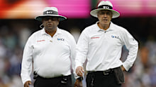 Umpires Ahsan Raza and Chris Gaffaney. 
