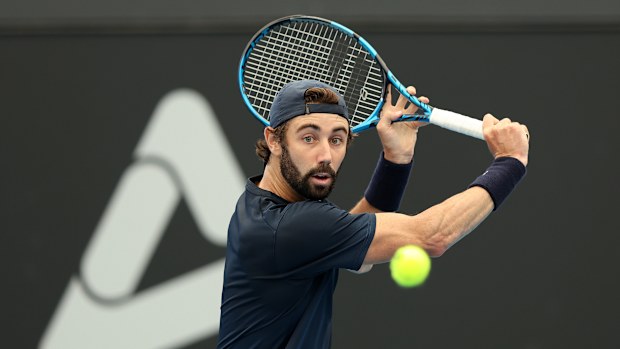 Jordan Thompson of Australia plays a backhand during their match against Facundo Diaz Acosta of Argentina  in the 2024 Adelaide International at Memorial Drive on January 09, 2024 in Adelaide, Australia. (Photo by Sarah Reed/Getty Images)