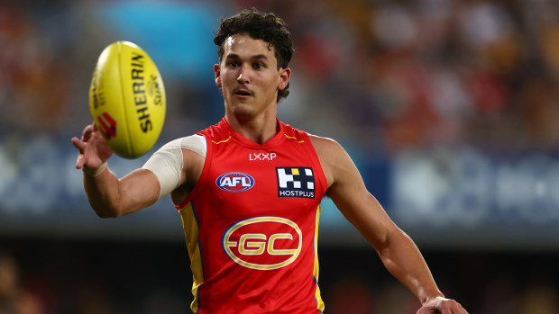 Wil Powell of the Suns warms up during the round five AFL match between Gold Coast Suns and Hawthorn Hawks at People First Stadium, on April 13, 2024, in Gold Coast, Australia. (Photo by Chris Hyde/Getty Images)