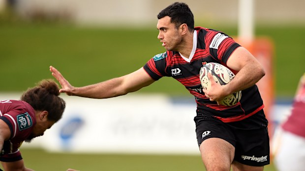 Jack Debreczeni of Canterbury attempts to fend off Isaac Te Tamaki of Southland.