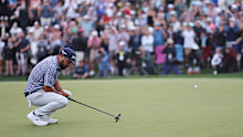 JJ Spaun of the United States reacts to the missed birdie putt on the 18th green.