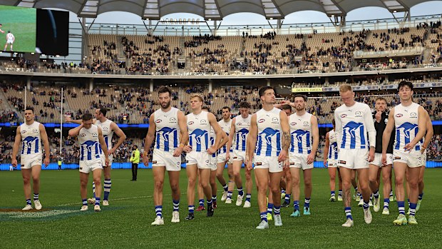 PERTH, AUSTRALIA - JULY 30: The Kangaroos walk from the field after being defeated during the round 20 AFL match between West Coast Eagles and North Melbourne Kangaroos at Optus Stadium, on July 30, 2023, in Perth, Australia. (Photo by Paul Kane/Getty Images)