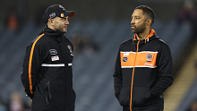 SYDNEY, AUSTRALIA - JUNE 02:  Tigers assistant coach Benji Marshall (R) and Robbie Farah chat during warm up ahead of the round 14 NRL match between Wests Tigers and Canberra Raiders at Campbelltown Stadium on June 02, 2023 in Sydney, Australia. (Photo by Cameron Spencer/Getty Images)
