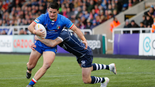 Daniel Atkinson of Italy goes for the tryline during the Rugby League World Cup Pool B match between Scotland and Italy.