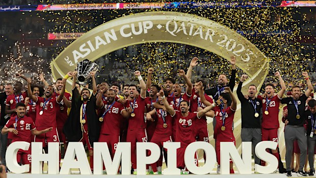 Hassan Al Haydos of Qatar lifts the AFC Asian Cup trophy after their team's victory in the AFC Asian Cup final match between Jordan and Qatar at Lusail Stadium on February 10, 2024 in Lusail City, Qatar. (Photo by Robert Cianflone/Getty Images)