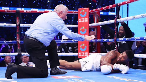 Anthony Joshua is counted out by referee Marcus McDonnell during his IBF World Heavyweight Title fight against Daniel Dubois.