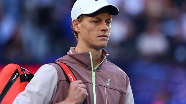 Jannik Sinner of Italy walks onto court ahead of their Men's Singles Final match against Daniil Medvedev during the 2024 Australian Open at Melbourne Park on January 28, 2024 in Melbourne, Australia. (Photo by Graham Denholm/Getty Images)