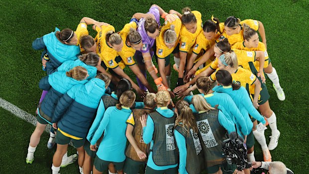 Australia huddle up ahead of their round of 16 match against Denmark.