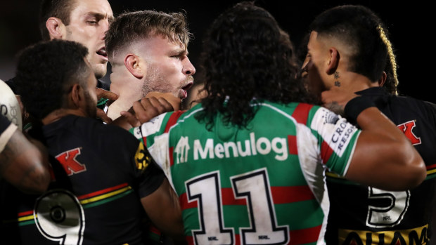 South Sydney forward Jai Arrow tangles with Panthers players.