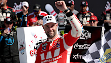 Shane Van Gisberge celebrates in victory lane after winning at Watkins Glen International.