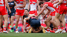 Toby Greene goes at it with Tom Papley.