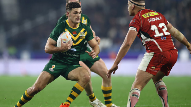 Nathan Cleary is challenged by Charbel Tasipale of Lebanon.