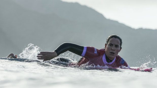 Australia's Tyler Wright paddles to the lineup.