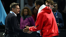 Felix Auger-Aliassime argues with the umpire as his Australian Open match is moved.