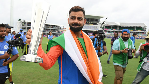 Virat Kohli holds the trophy during a lap of honour after India won the ICC Men's T20 Cricket World Cup West Indies & USA 2024 Final match between South Africa and India at Kensington Oval on June 29, 2024 in Bridgetown, Barbados. (Photo by Philip Brown/Getty Images)