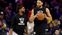 PHILADELPHIA, PENNSYLVANIA - MARCH 10:  Patty Mills #8 and Ben Simmons #10 of the Brooklyn Nets take the court for warm ups before the game against the Philadelphia 76ers at Wells Fargo Center on March 10, 2022 in Philadelphia, Pennsylvania. NOTE TO USER: User expressly acknowledges and agrees that, by downloading and or using this photograph, User is consenting to the terms and conditions of the Getty Images License Agreement. (Photo by Elsa/Getty Images)